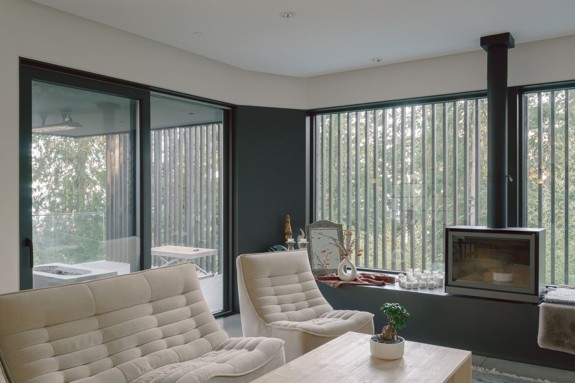 Bayridge — Living room with freestanding stove and screened glazing