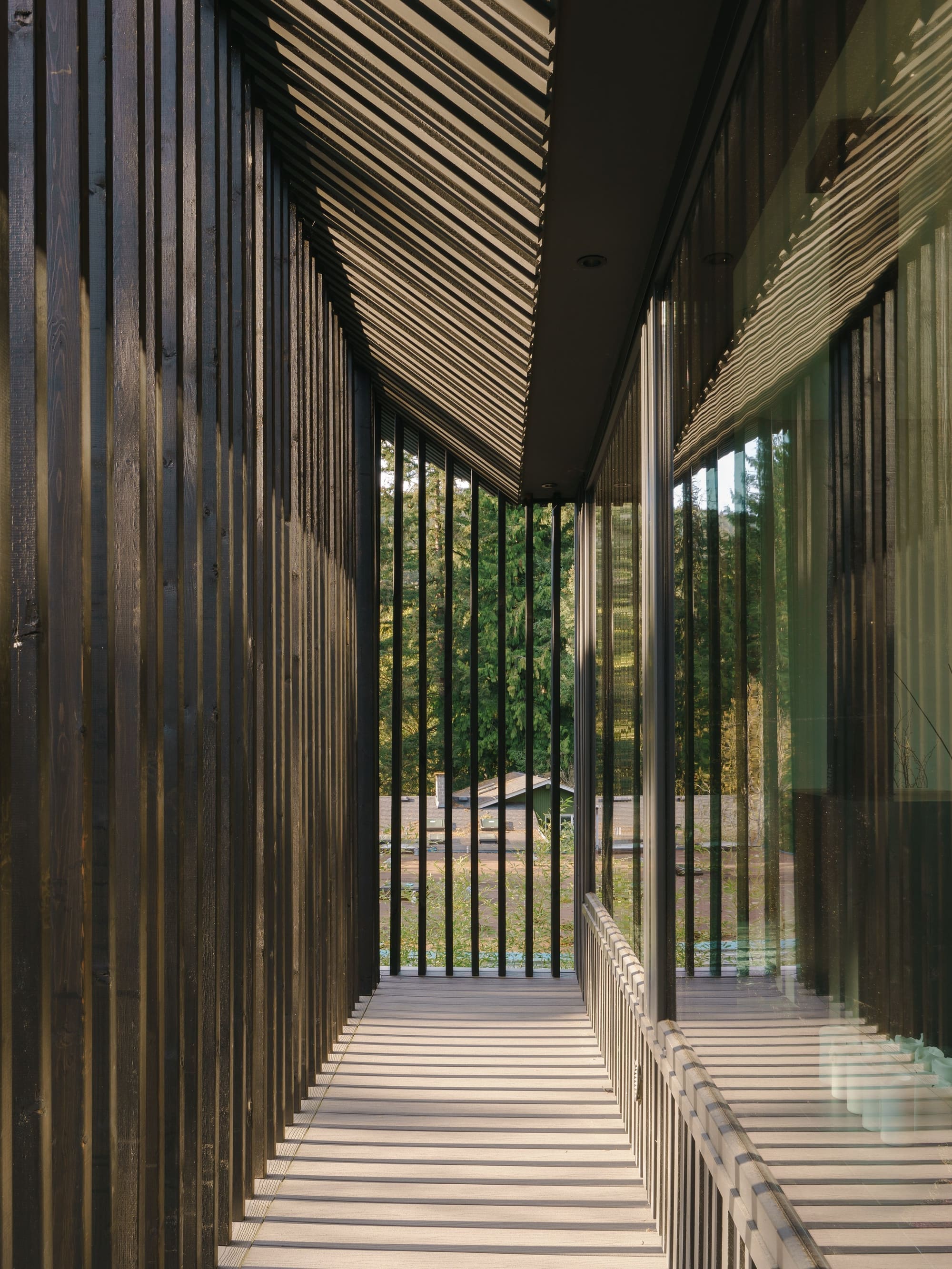Bayridge — Narrow exterior passage framed by vertical screens