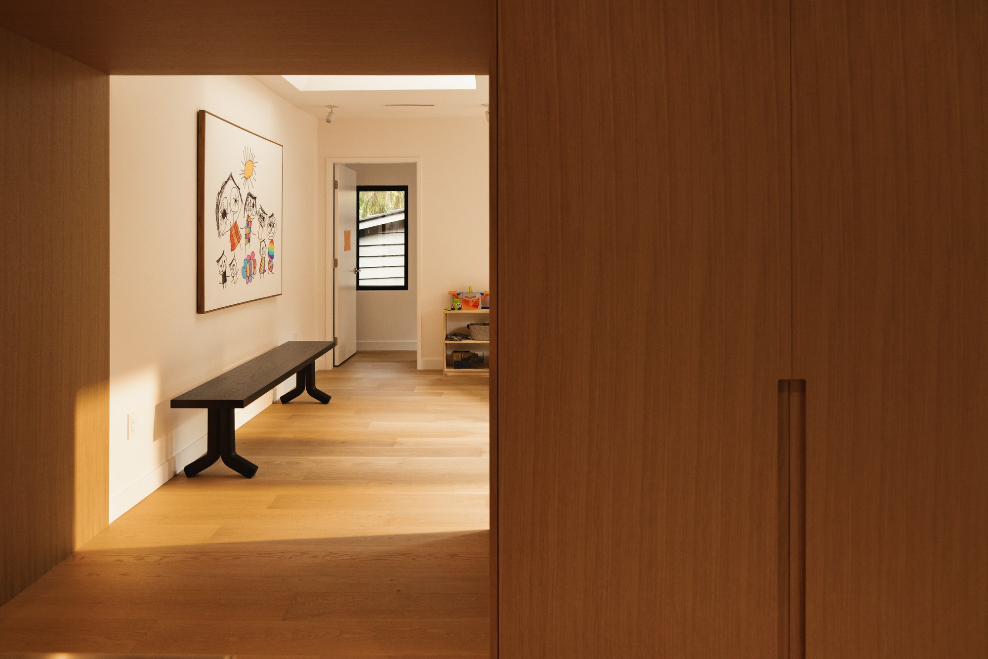 View through a timber opening into the upper hall.