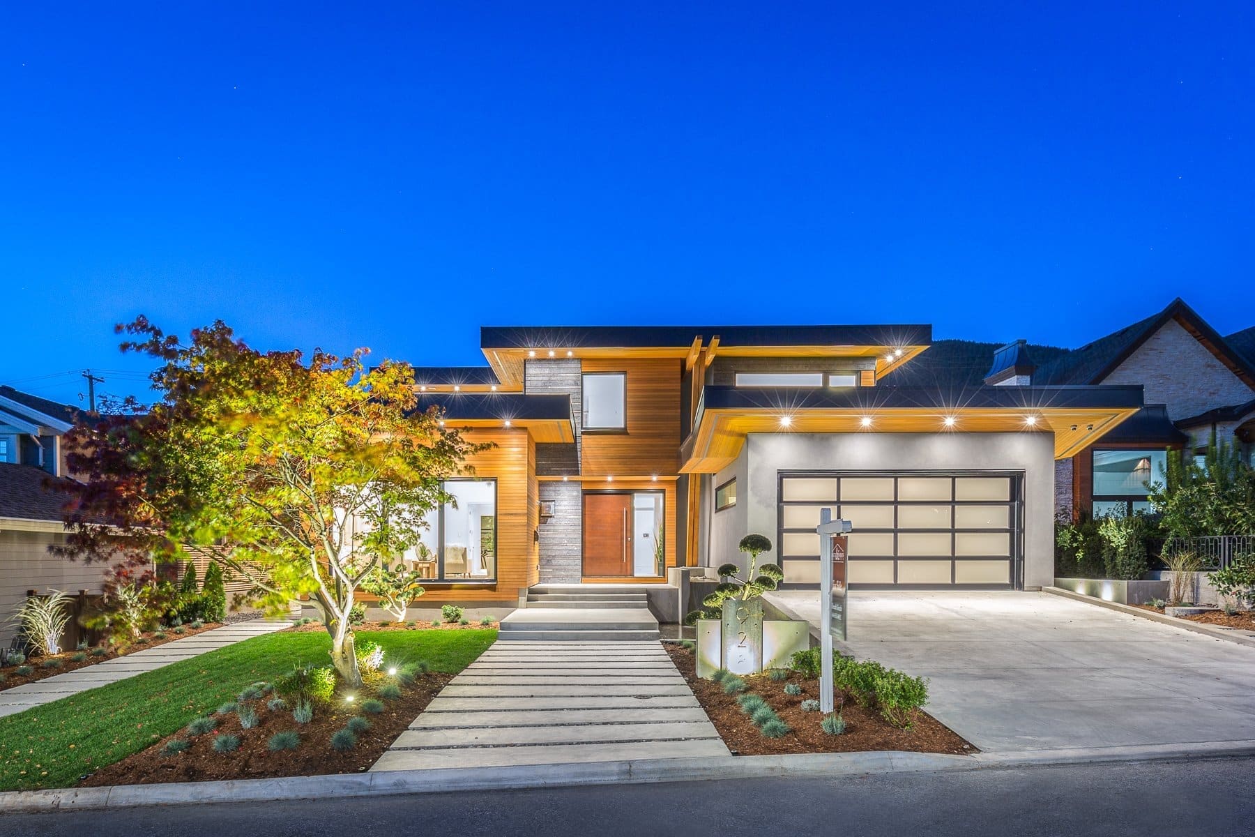 Wavertree — Illuminated street elevation and driveway at dusk
