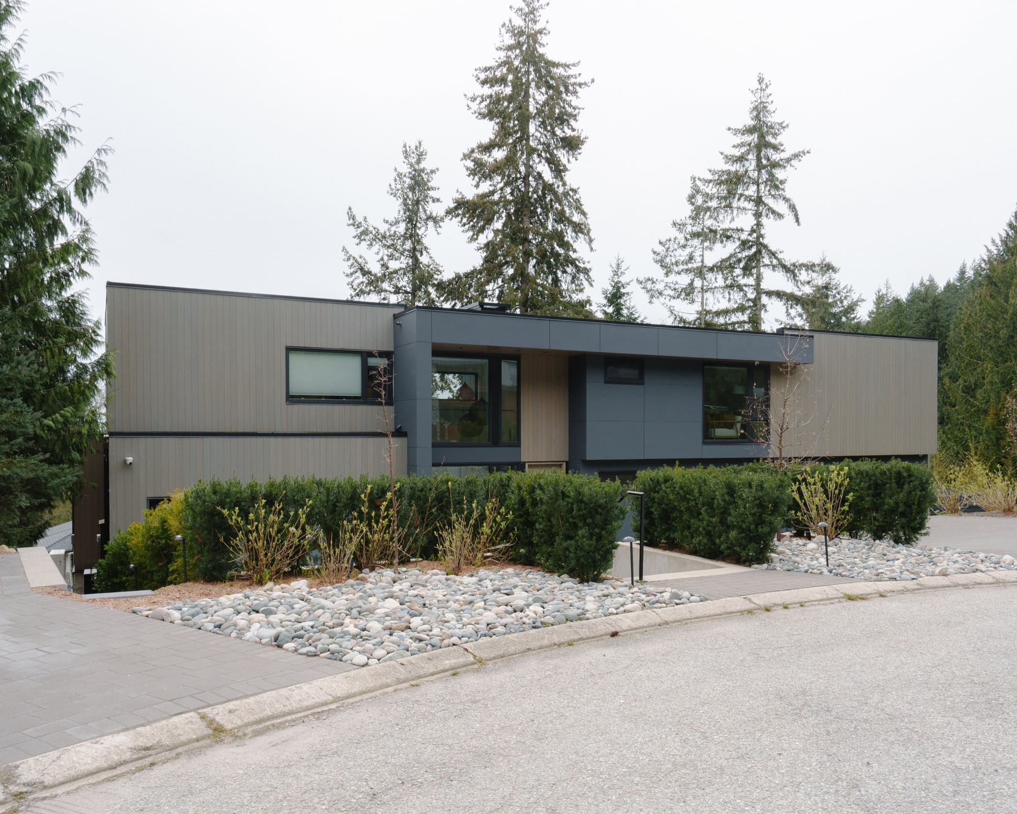 Woodgreen — Street-facing elevation with timber cladding and dark window frames