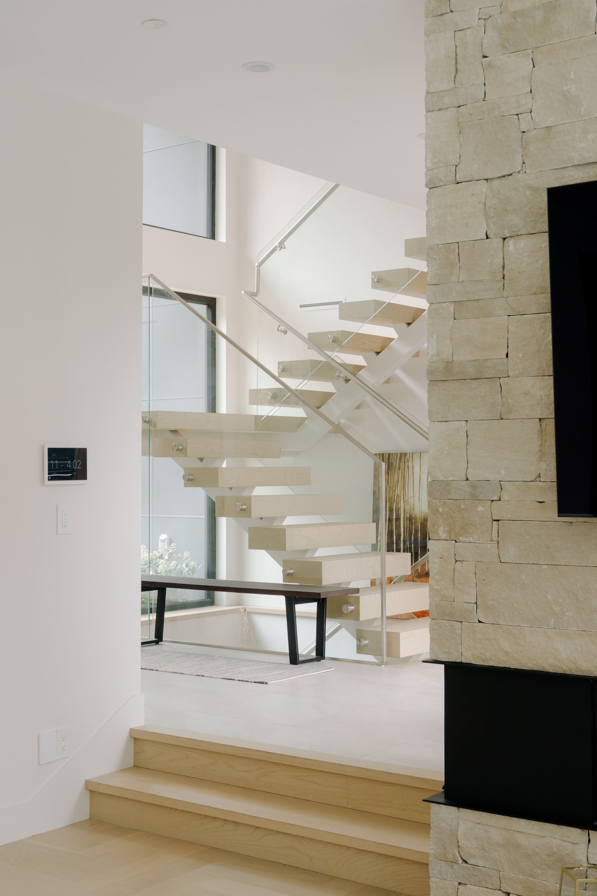 Photography: Shane Hauser Woodgreen — Floating timber stair beside a double-height window